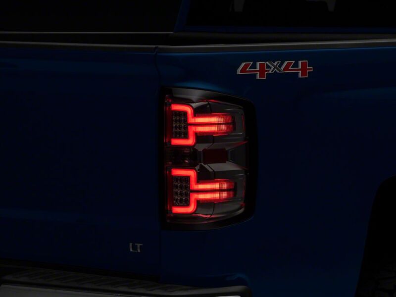Raxiom 14-18 Chevrolet Silverado 1500 LED Tail Lights/SeqTurn Signals- Chrome- Smoked Lens - S114458 - close-up view 2