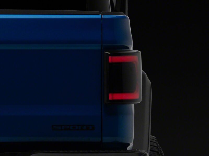 Raxiom 20-26 Jeep Gladiator JT Low Profile LED Tail Lights- Black Housing- Smoked Lens - JG27784 - close-up view 2