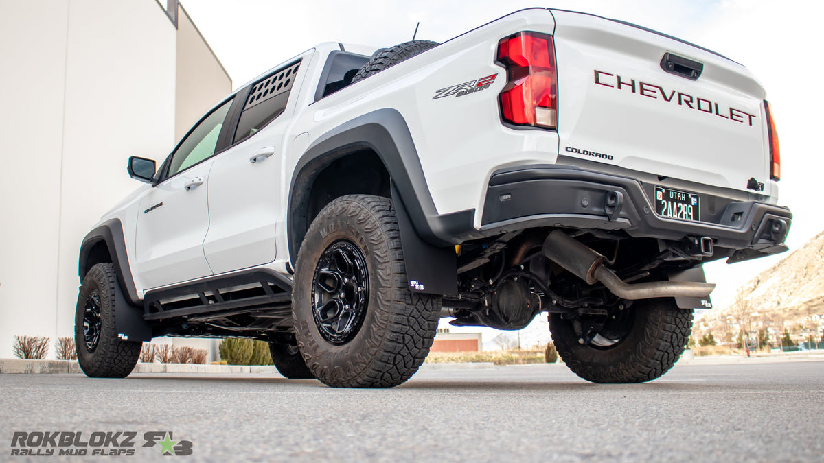 2023 Chevy Colorado ZR2 Bison featuring Rokblokz mud flaps - driver 3/4 view