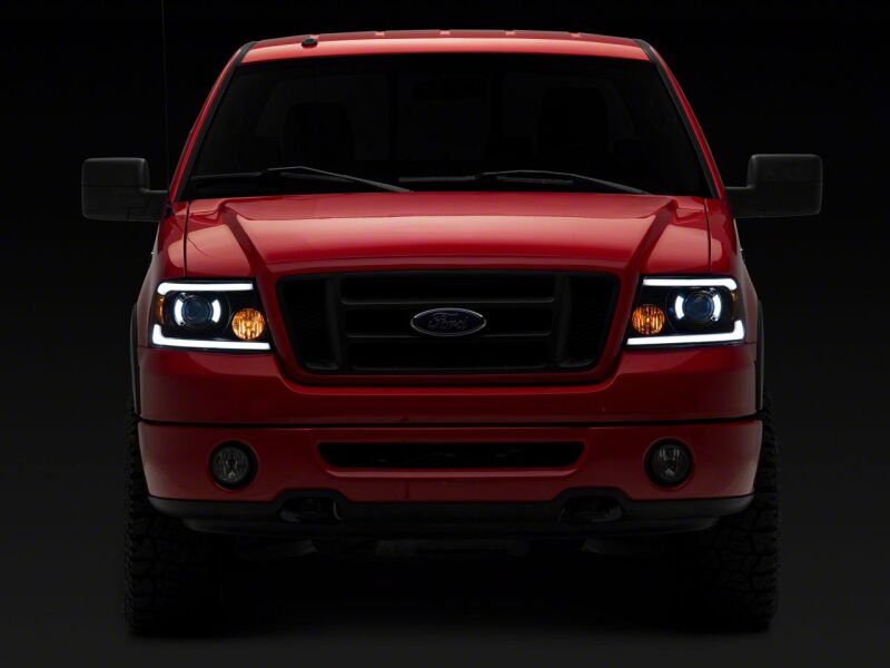 Raxiom 04-08 Ford F-150 Axial Series Projector Headlights with LED Bar- Black Housing- Clear Lens - T566363 for 2004-2008 Ford F 150 - close-up view