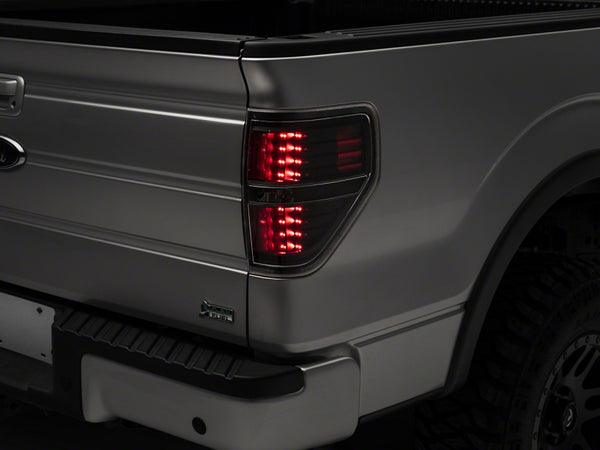 Raxiom 09-14 Ford F-150 Styleside LED Tail Lights- Blk Housing (Clear Lens) - T542842 for 2009-2014 Ford F 150 - front view
