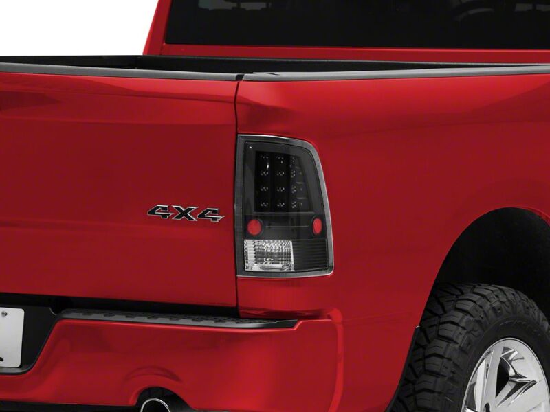 Raxiom 09-18 Dodge RAM 1500 LED Tail Lights- Black Housing- Clear Lens - R110154 - front view