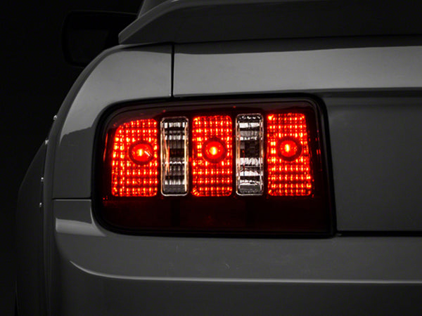 Raxiom 05-09 Ford Mustang Coyote Tail Lights- Blk Housing (Smoked Lens) - 49117 for 2005-2009 Ford Mustang - front view