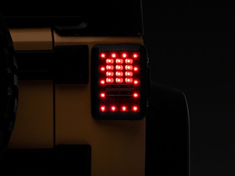 Raxiom 07-18 Jeep Wrangler JK Axial Series LED Tail Lights- Blk Housing (Clear Lens) - J141585