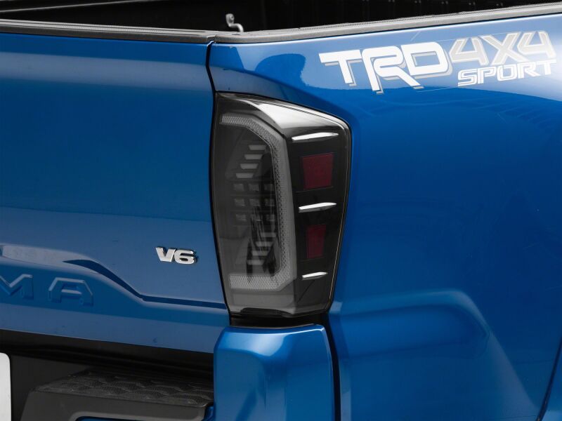 Raxiom 16-23 Toyota Tacoma LED Tail Lights- Black Housing- Clear Lens - TT15696 - angle view