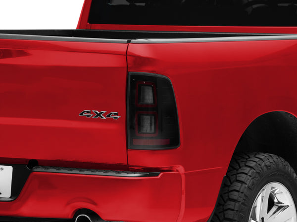 Raxiom 09-18 Dodge RAM 1500 LED Tail Lights- Black Housing (Smoked Lens) - R110172 for 2011-2018 Ram 1500 - front view