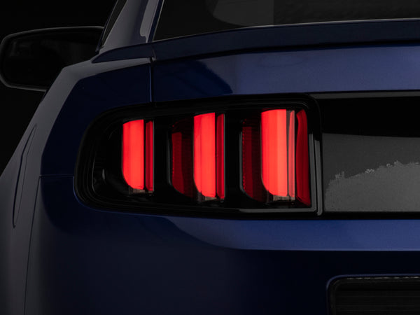 Raxiom 13-14 Ford Mustang Vector V2 Tail Lights- Black Housing (Clear Lens) - 408606 for 2013-2014 Ford Mustang - front view