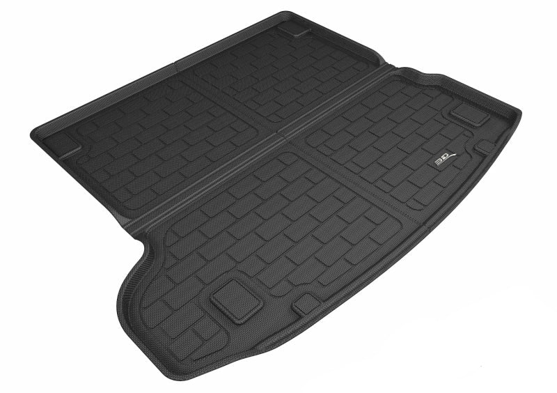 Black 3D MAXpider cargo liner for vehicles, displayed with an embossed pattern, indicating it is made of carbon fiber.