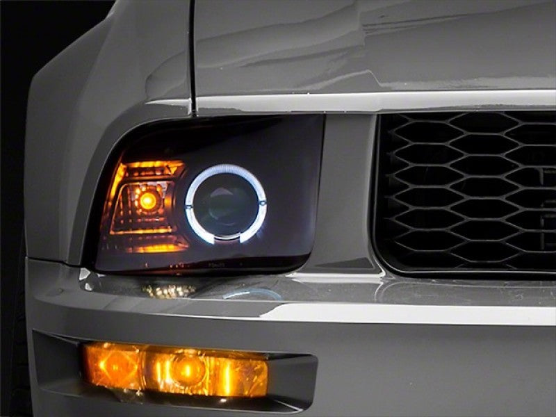 Raxiom 05-09 Ford Mustang Halogen 2010 Style LED Halo Headlights-Blk Hsng(Clear Lens/Excludes GT500) - 101682