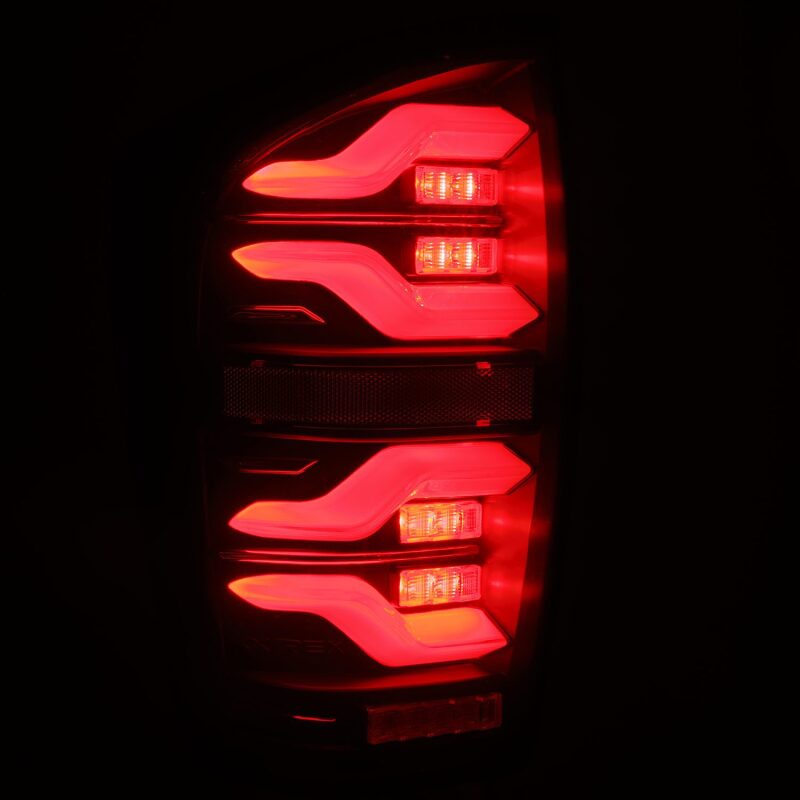 AlphaRex 16-21 Toyota Tacoma LUXX LED Taillights Blk w/Activ Light/Seq Signal - 680090