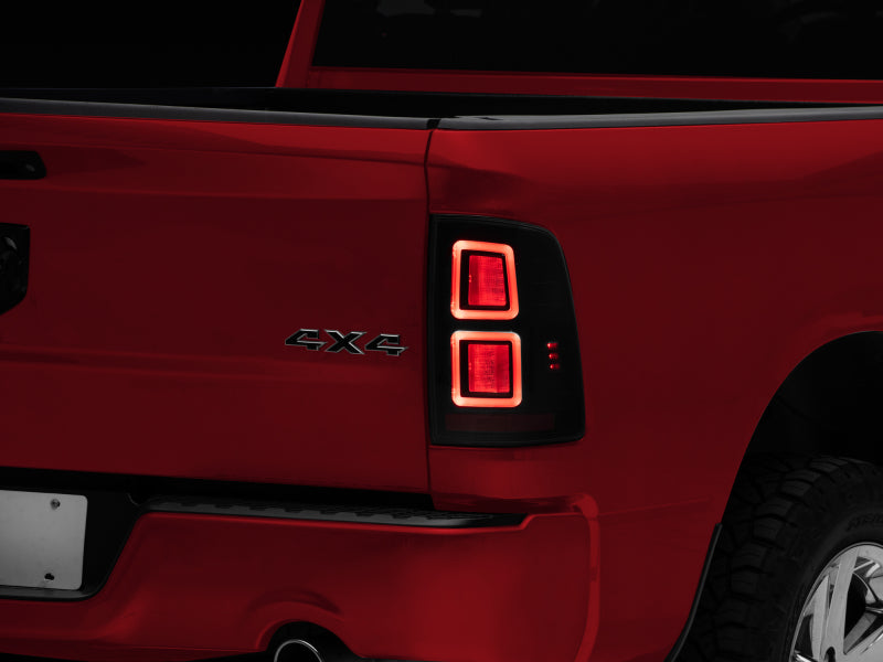 Raxiom 09-18 Dodge RAM 1500 LED Tail Lights- Black Housing (Smoked Lens) - R110172