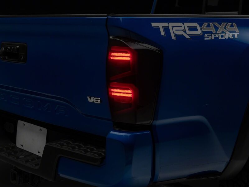Raxiom 16-23 Toyota Tacoma ST LED Tail Lights- Black Housing- Smoked Lens - TT42787 - close-up view