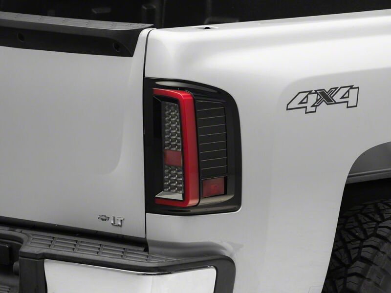 Raxiom 07-13 Chevrolet Silverado 1500 G2 LED Tail Lights- Black Housing- Smoked Lens - S112739 - close-up view 4