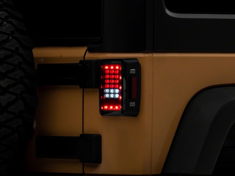 Raxiom 07-18 Jeep Wrangler JK Axial Series LED Tail Lights- Blk Housing (Clear Lens) - J141585