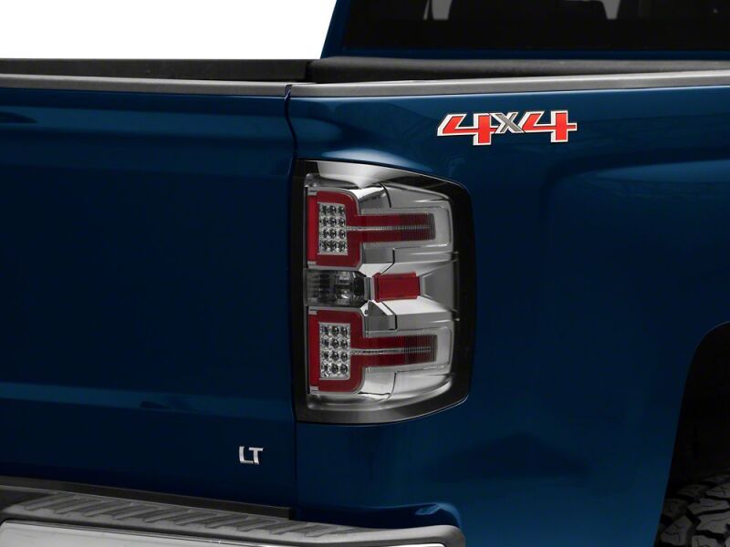 Raxiom 14-18 Chevrolet Silverado 1500 LED Tail Lights/SeqTurn Signals- Chrome- Smoked Lens - S114458 - front view