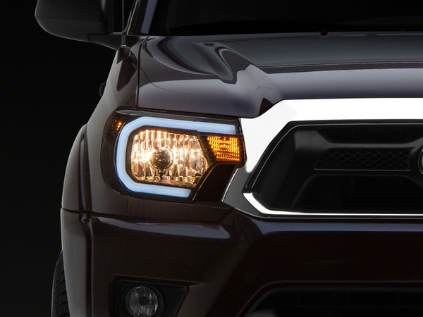 Raxiom 12-15 Toyota Tacoma Axial Series Headlights w/ LED Bar- Blk Housing (Clear Lens) - TT21847 for 2012-2015 Toyota Tacoma