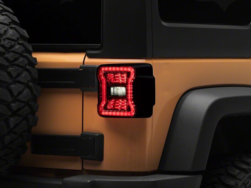 Raxiom 07-18 Jeep Wrangler JK Axial Series JL Style LED Tail Lights- Black Housing- Smoked Lens - J183257 - close-up view 10
