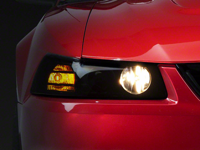 Raxiom 99-04 Ford Mustang Axial Series Projector Headlights- Blk Housing (Smoked Lens) - 49126