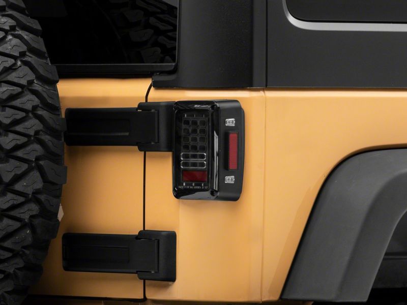 Raxiom 07-18 Jeep Wrangler JK Axial Series LED Tail Lights- Blk Housing (Clear Lens) - J141585