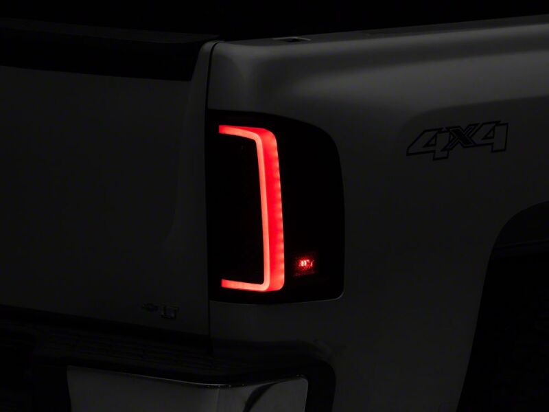 Raxiom 07-13 Chevrolet Silverado 1500 G2 LED Tail Lights- Black Housing- Smoked Lens - S112739 - front view