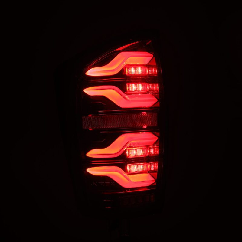 AlphaRex 16-21 Toyota Tacoma LUXX LED Taillights Alpha Blk w/Activ Light/Seq Signal - 680080
