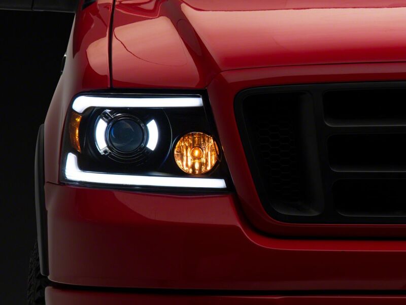 Raxiom 04-08 Ford F-150 Axial Series Projector Headlights with LED Bar- Black Housing- Clear Lens - T566363 for 2004-2008 Ford F 150 - close-up view 10
