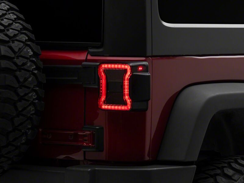 Raxiom 07-18 Jeep Wrangler JK LED Tail Lights- Red Housing- Smoked Lens - J181427 - front view