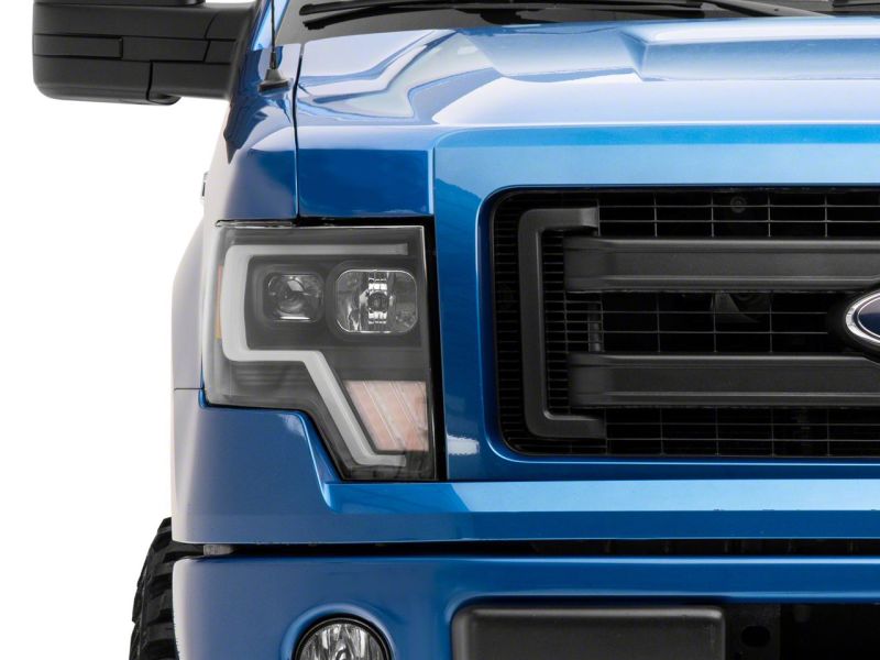Raxiom 09-14 Ford F-150 Axial G4 Light Bar Switchback Projector Headlights- Blk Housing (Clear Lens) - T546755