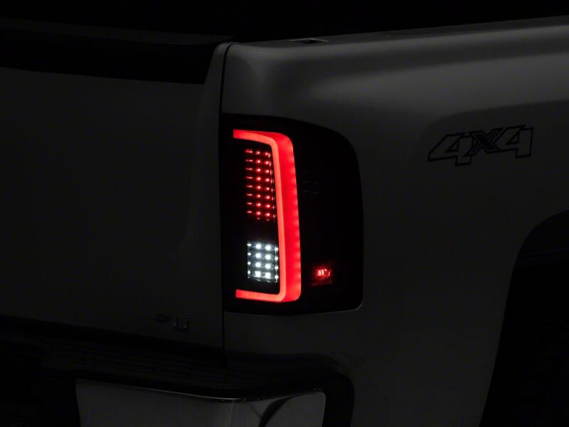 Raxiom 07-13 Chevrolet Silverado 1500 G2 LED Tail Lights- Black Housing- Smoked Lens - S112739 - close-up view 9