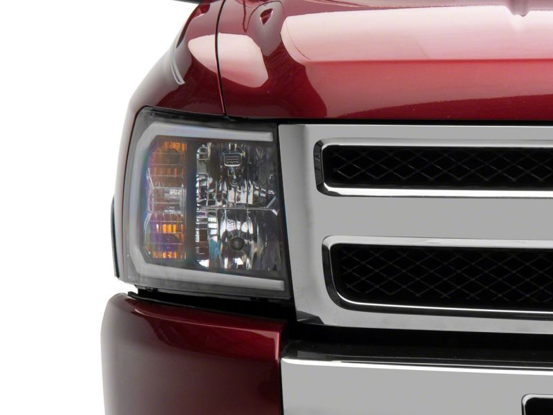 Raxiom 07-13 Chevrolet Silverado 1500 Axial Headlights w/ SEQL LED Bar- Blk Housing (Clear Lens) - S138004
