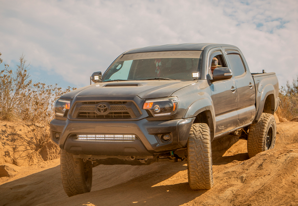 Cali Raised 05-15 Toyota Tacoma Low Prof Ditch Light Brackets Kit W/ Blue Backlight - Small - CR2862 - front view