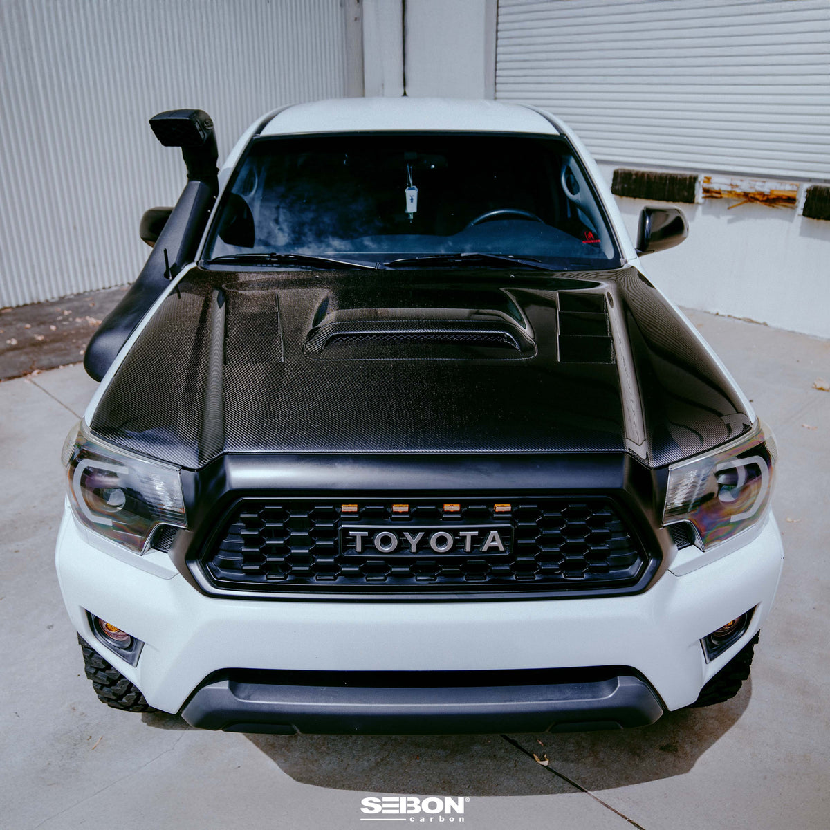 Seibon 12-15 Toyota Tacoma TS-Style Carbon Fiber Hood - HD12TYTA-TS