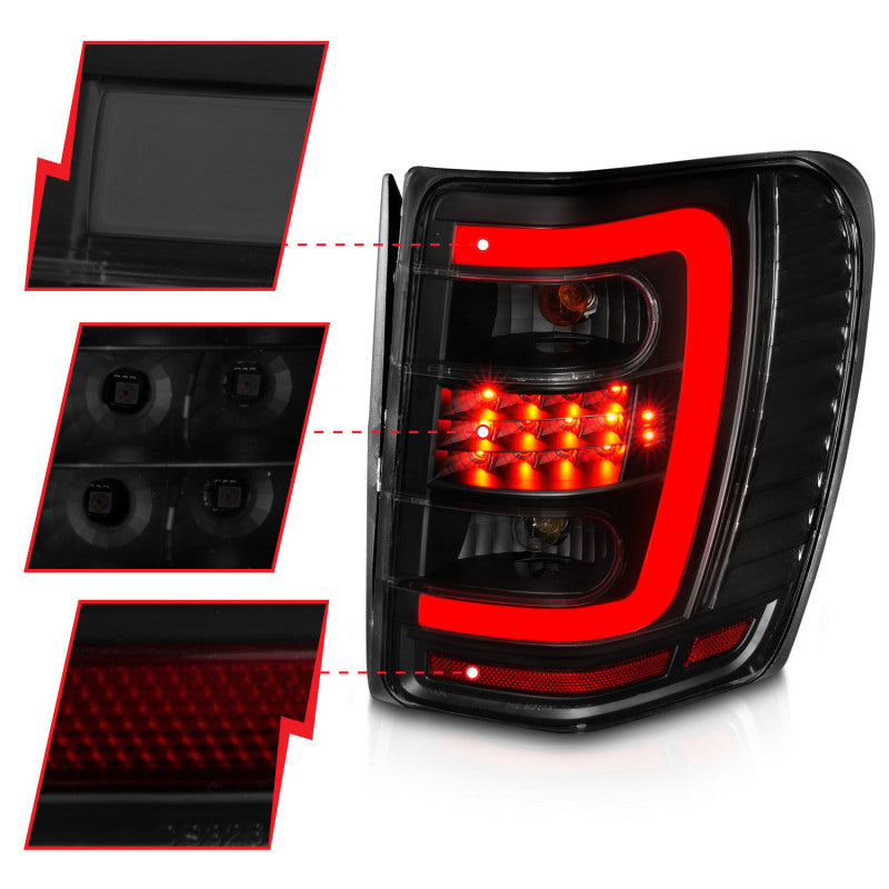 ANZO 1999-2004 Jeep Grand Cherokee LED Tail Lights w/ Light Bar Black Housing Smoke Lens - 311395