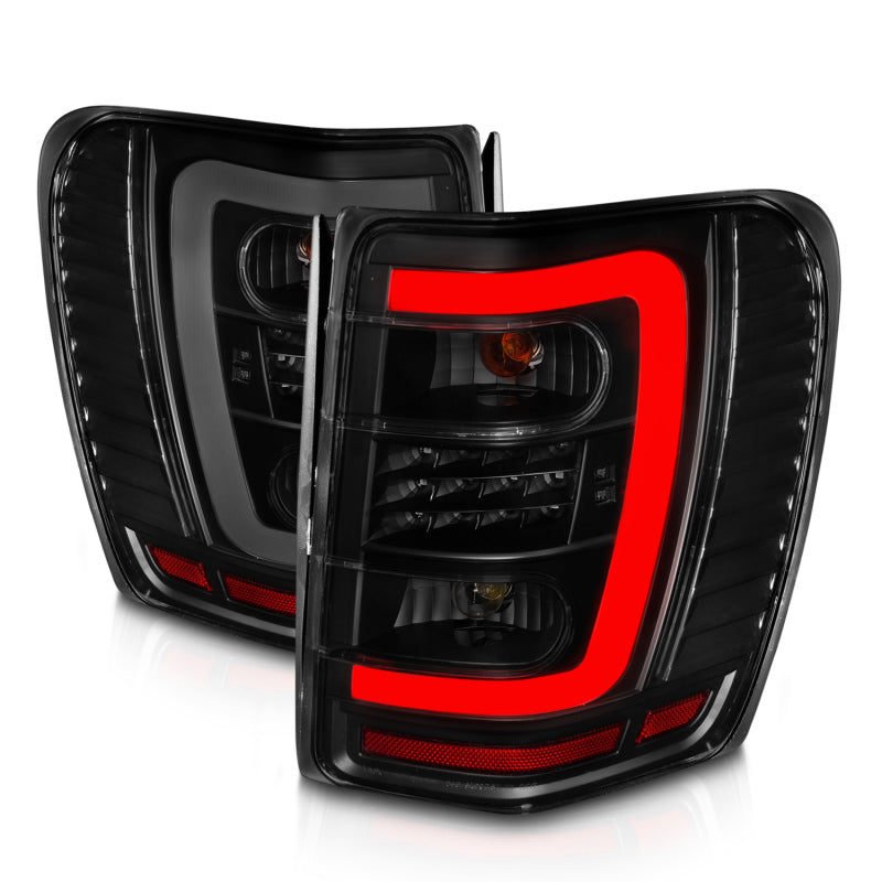 ANZO 1999-2004 Jeep Grand Cherokee LED Tail Lights w/ Light Bar Black Housing Smoke Lens - 311395