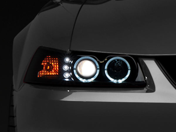 Raxiom 99-04 Ford Mustang Dual LED Halo Projector Headlights- Black Housing (Smoked Lens) - 49113 for 1999-2004 Ford Mustang 