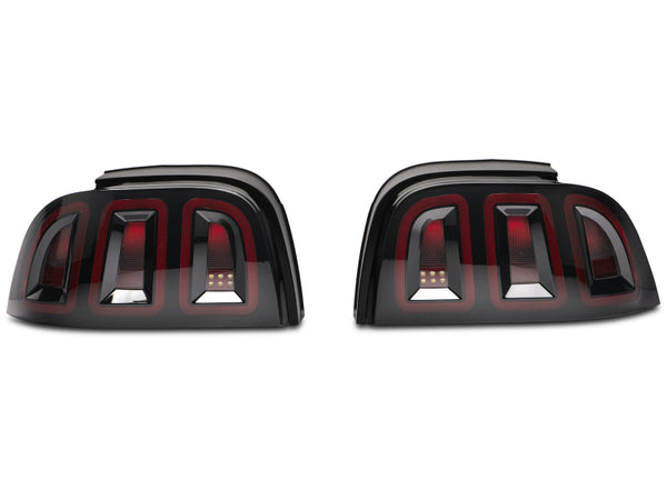 Raxiom 96-98 Ford Mustang Icon LED Tail Lights- Black Housing (Smoked Lens) - 389876 for 1996-1998 Ford Mustang - front view