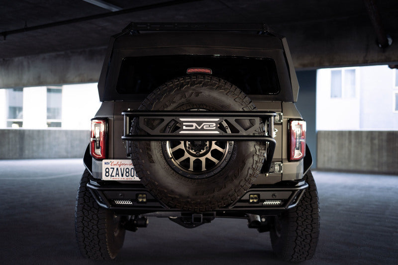 DV8 Offroad 21-23 Ford Bronco Spare Tire Guard &amp; Accessory Mount - TCBR-01