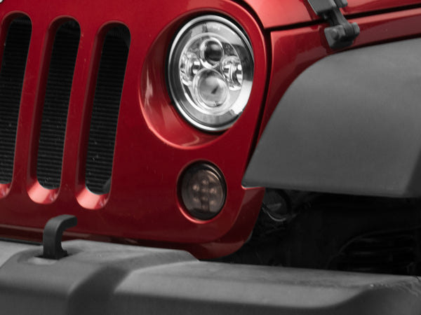 Raxiom 07-18 Jeep Wrangler JK Axial Series LED Amber Turn Signals (Smoked) - J108040 for 2007-2018 Jeep Wrangler - front view